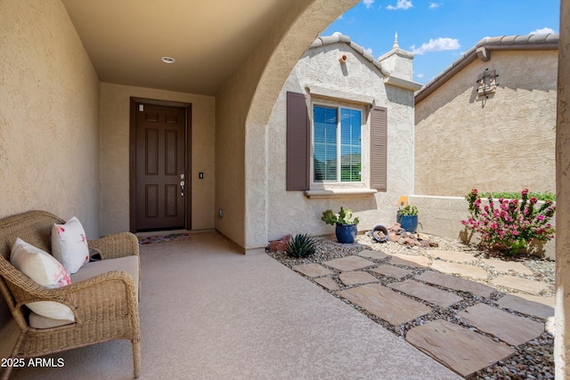 property entrance featuring stucco siding