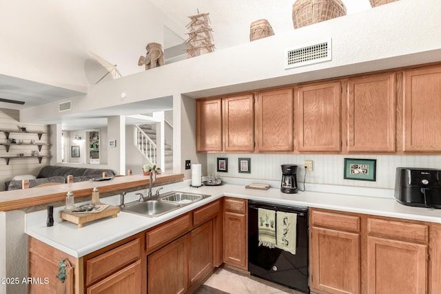 kitchen featuring dishwasher, light tile patterned floors, kitchen peninsula, and sink