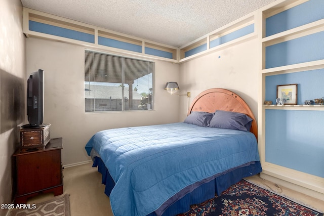 carpeted bedroom featuring a textured ceiling