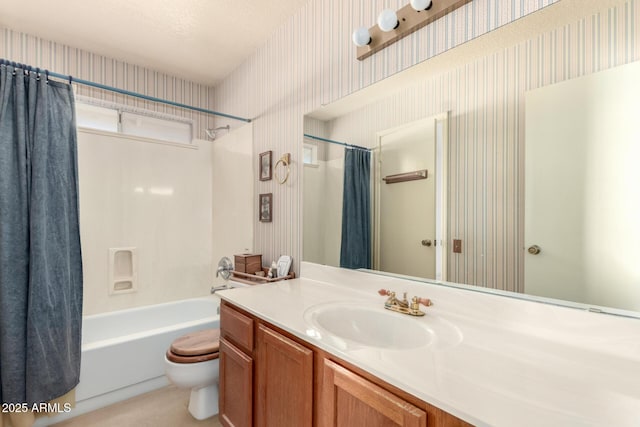 full bathroom featuring vanity, toilet, shower / bathtub combination with curtain, and a textured ceiling