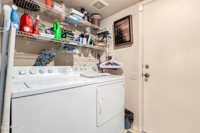 clothes washing area with independent washer and dryer