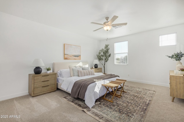 bedroom with light carpet, baseboards, and ceiling fan