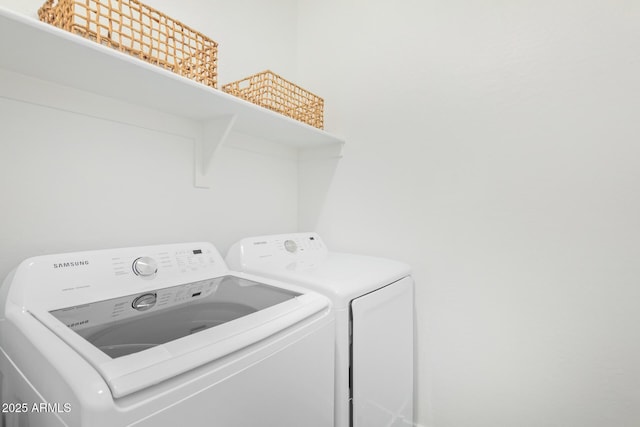 laundry room with washer and dryer