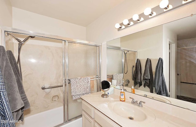 bathroom featuring vanity and combined bath / shower with glass door