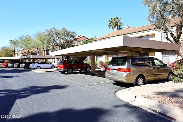 view of vehicle parking with a carport