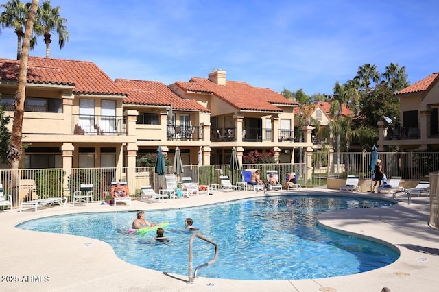 view of swimming pool with a patio area