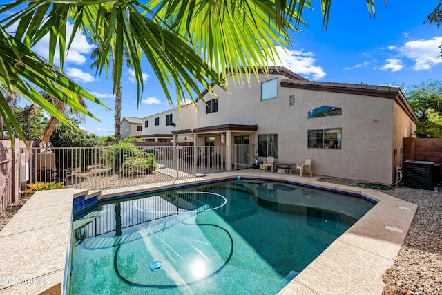 view of swimming pool with a patio area and cooling unit