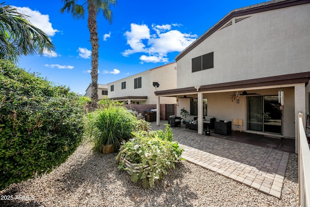 view of yard with ceiling fan, a patio area, and outdoor lounge area