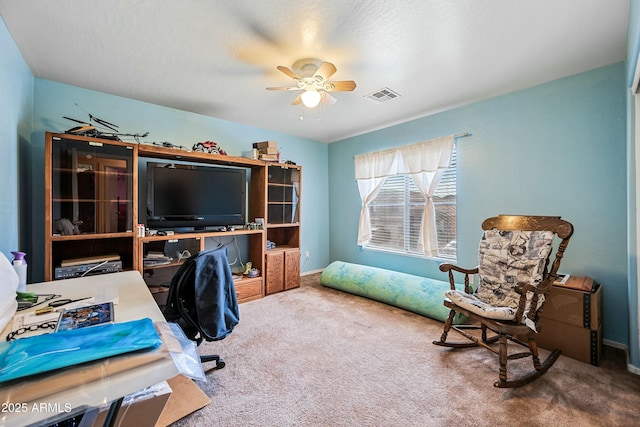 office space with ceiling fan and carpet flooring