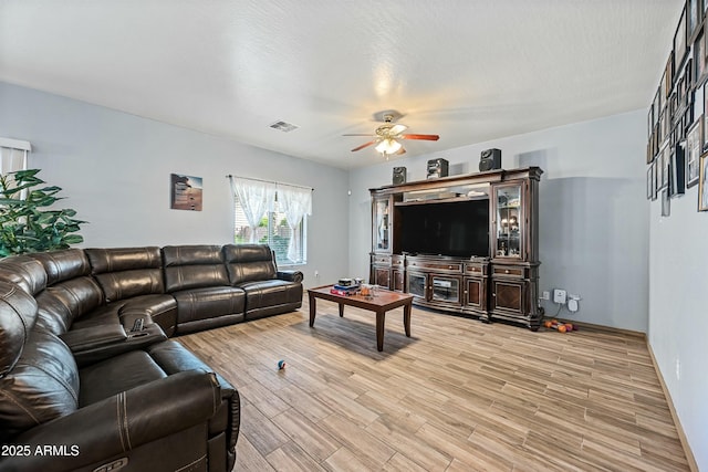 living room featuring ceiling fan