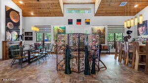dining area with wood ceiling and a towering ceiling