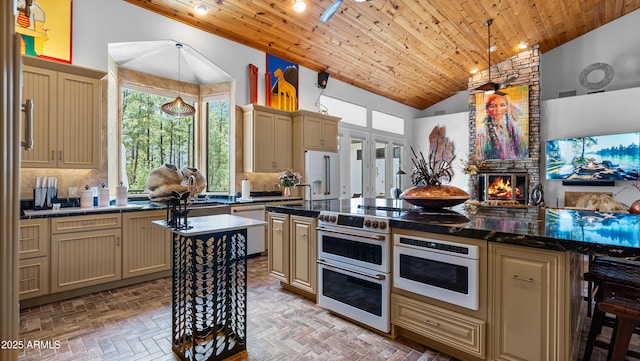 kitchen with wood ceiling, white appliances, cream cabinetry, and a healthy amount of sunlight