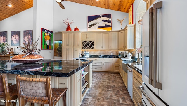 kitchen with wood ceiling, cream cabinetry, and white appliances