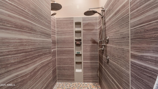 full bath with a tile shower