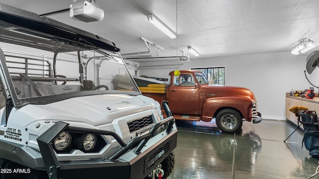 garage featuring baseboards and a garage door opener