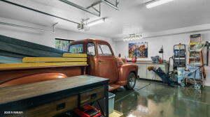 interior space featuring a garage and finished concrete flooring