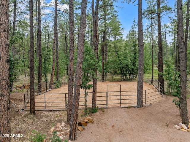 view of gate with an enclosed area and fence