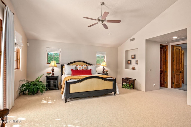 carpeted bedroom featuring lofted ceiling and ceiling fan