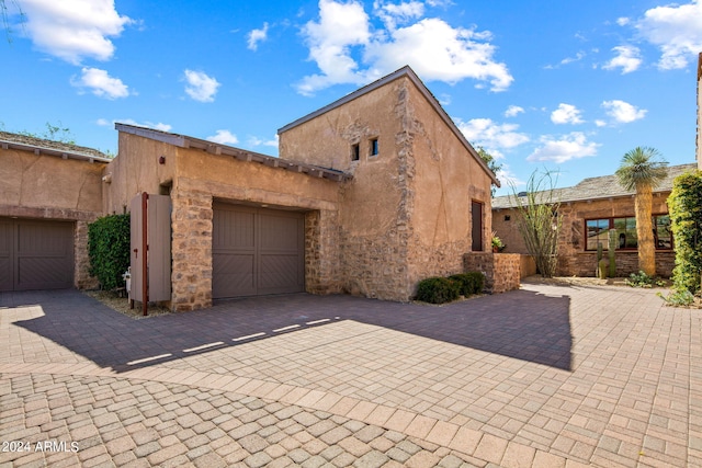 adobe home featuring a garage