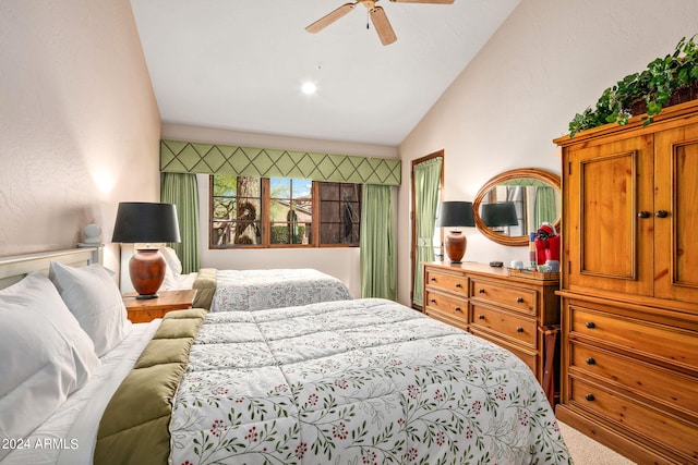 bedroom featuring carpet flooring, ceiling fan, and vaulted ceiling