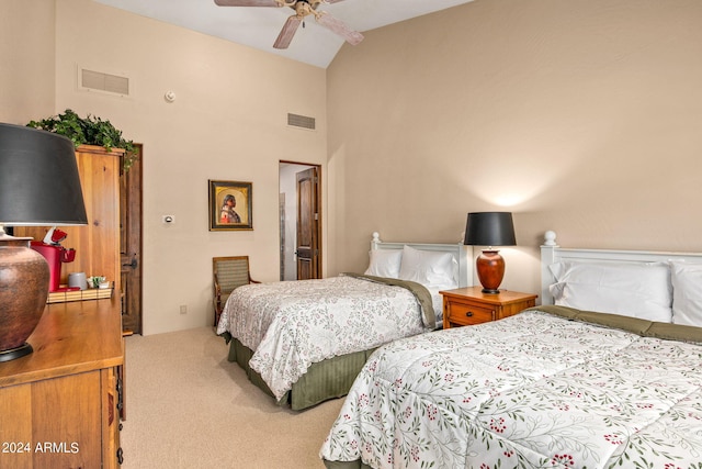 carpeted bedroom featuring high vaulted ceiling and ceiling fan