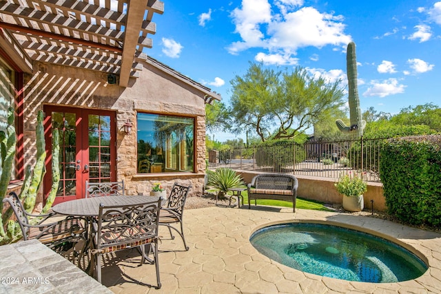 view of pool with an in ground hot tub, a patio, and a pergola