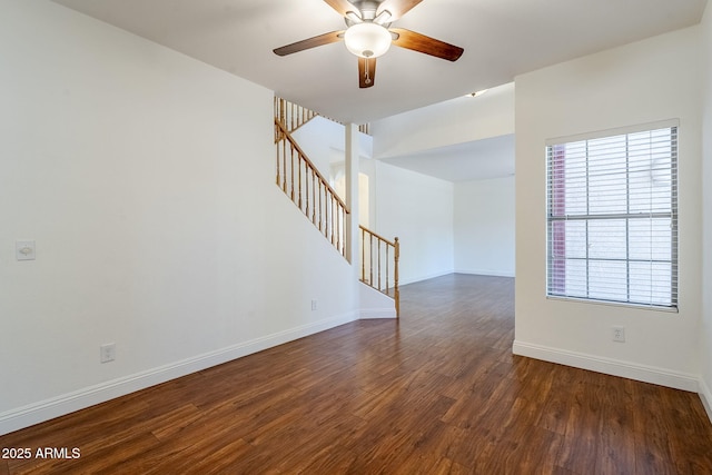 1031 W Longhorn Dr, Chandler, AZ 85286 - unfurnished room with dark wood-style flooring, ceiling fan, stairs, and baseboards