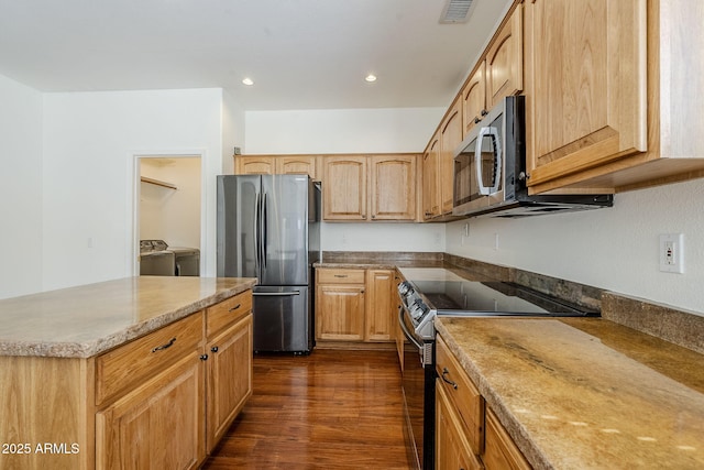 1031 W Longhorn Dr, Chandler, AZ 85286 - kitchen featuring stainless steel appliances, dark wood-style flooring, separate washer and dryer, recessed lighting, and light stone counters