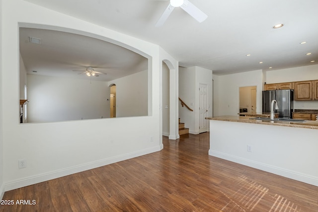 1031 W Longhorn Dr, Chandler, AZ 85286 - kitchen with a ceiling fan, freestanding refrigerator, recessed lighting, wood finished floors, and baseboards