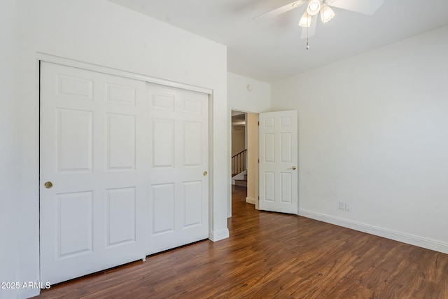 1031 W Longhorn Dr, Chandler, AZ 85286 - unfurnished bedroom featuring dark wood finished floors, a closet, baseboards, and ceiling fan