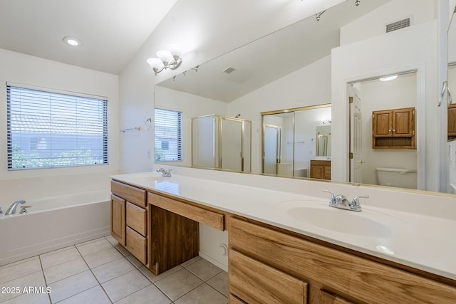 1031 W Longhorn Dr, Chandler, AZ 85286 - bathroom with double vanity, tile patterned floors, a bath, a stall shower, and toilet