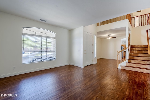 1031 W Longhorn Dr, Chandler, AZ 85286 - unfurnished living room featuring wood finished floors, stairway, baseboards, and ceiling fan