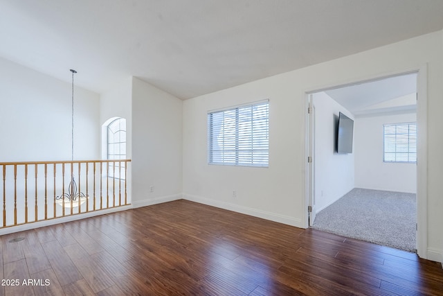 1031 W Longhorn Dr, Chandler, AZ 85286 - spare room with wood finished floors, vaulted ceiling, and baseboards