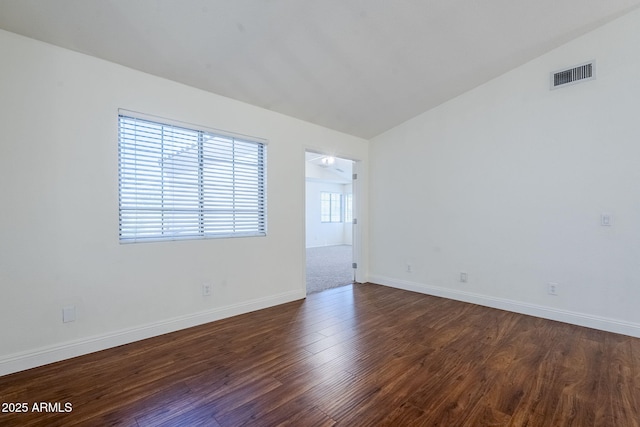 1031 W Longhorn Dr, Chandler, AZ 85286 - unfurnished room with dark wood finished floors, baseboards, and lofted ceiling