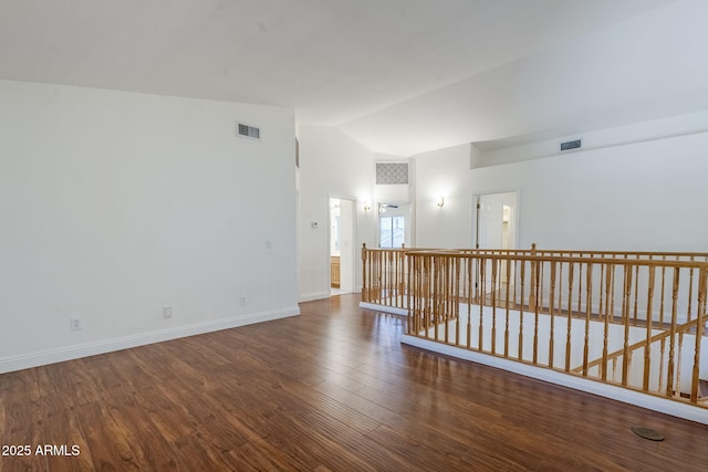 1031 W Longhorn Dr, Chandler, AZ 85286 - unfurnished room with wood finished floors, baseboards, and high vaulted ceiling
