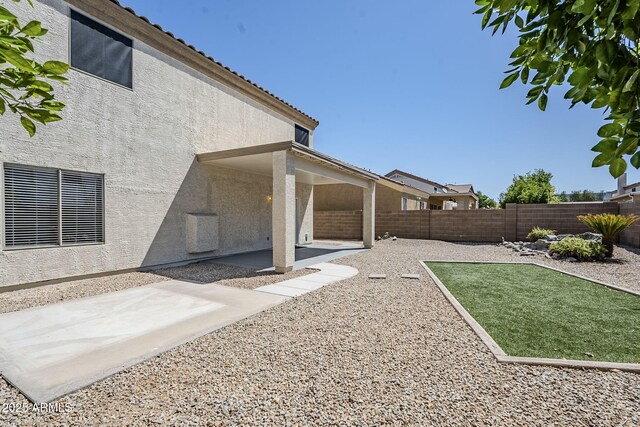 1031 W Longhorn Dr, Chandler, AZ 85286 - fenced backyard with a patio