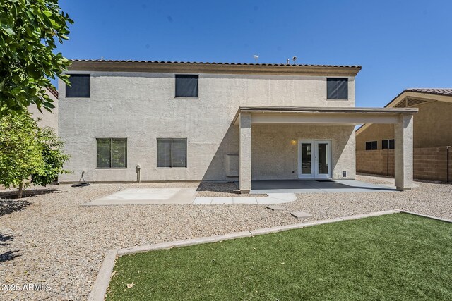 1031 W Longhorn Dr, Chandler, AZ 85286 - back of property featuring french doors, a patio area, and stucco siding