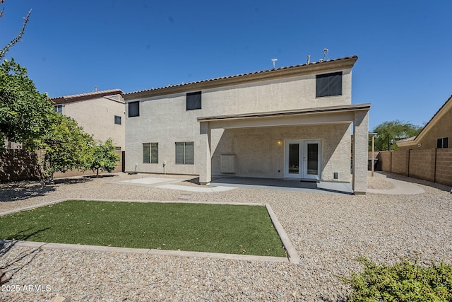 1031 W Longhorn Dr, Chandler, AZ 85286 - rear view of property featuring french doors, a patio area, a fenced backyard, and stucco siding