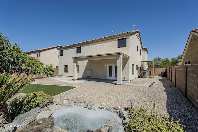1031 W Longhorn Dr, Chandler, AZ 85286 - back of house with french doors, a patio, stucco siding, and a fenced backyard