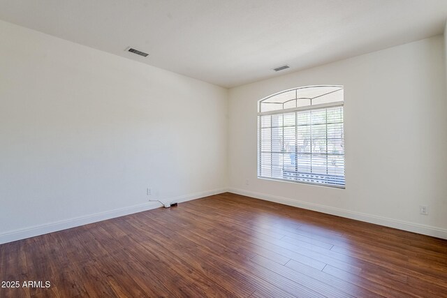 1031 W Longhorn Dr, Chandler, AZ 85286 - spare room with dark wood-type flooring and baseboards