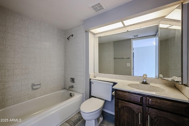 full bathroom with tiled shower / bath combo, vanity, and toilet