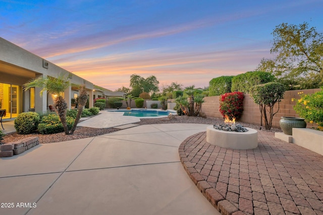2472 E Prescott Pl, Chandler, AZ 85249 - pool at dusk with a patio area and a fenced backyard