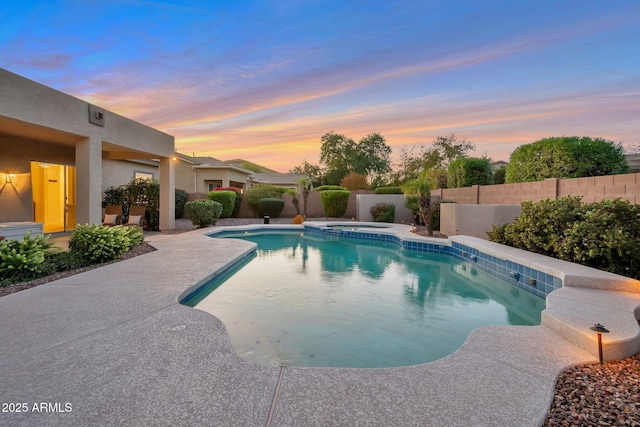 2472 E Prescott Pl, Chandler, AZ 85249 - pool at dusk featuring an in-ground hot tub, a fenced backyard, and a patio area