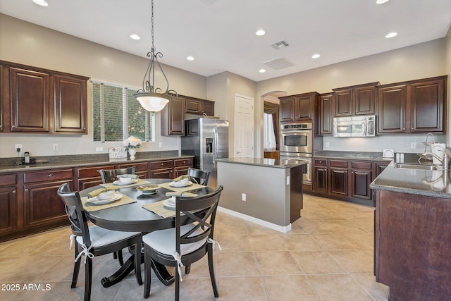 2472 E Prescott Pl, Chandler, AZ 85249 - kitchen with appliances with stainless steel finishes, a sink, recessed lighting, pendant lighting, and a kitchen island