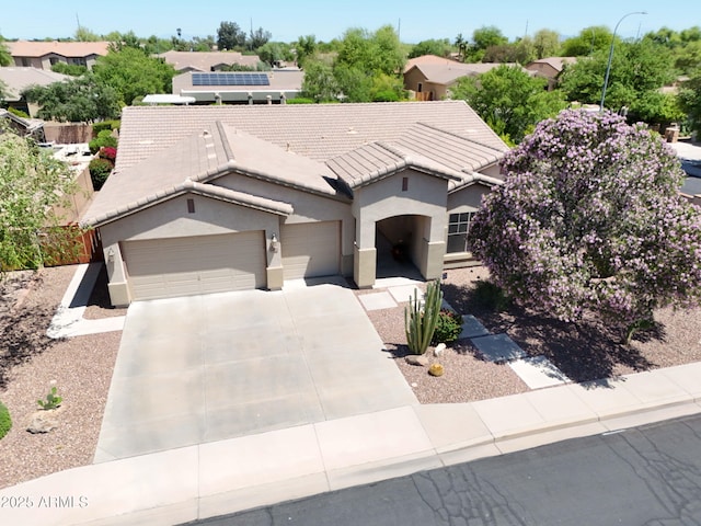 2472 E Prescott Pl, Chandler, AZ 85249 - view of front of home with an attached garage, a tiled roof, stucco siding, and driveway