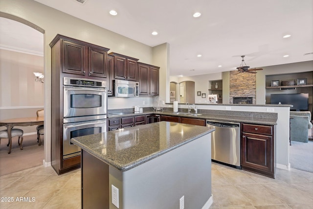 2472 E Prescott Pl, Chandler, AZ 85249 - kitchen with appliances with stainless steel finishes, arched walkways, ceiling fan, a peninsula, and recessed lighting