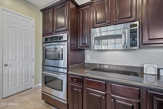2472 E Prescott Pl, Chandler, AZ 85249 - kitchen with appliances with stainless steel finishes, dark brown cabinetry, dark stone countertops, and light tile patterned floors