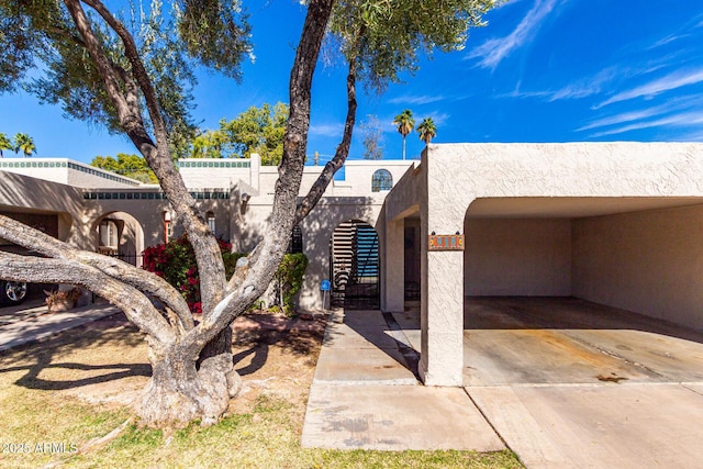 view of front of property with a carport