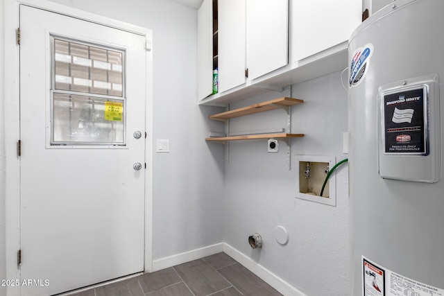 clothes washing area with cabinets, hookup for a washing machine, water heater, and hookup for an electric dryer