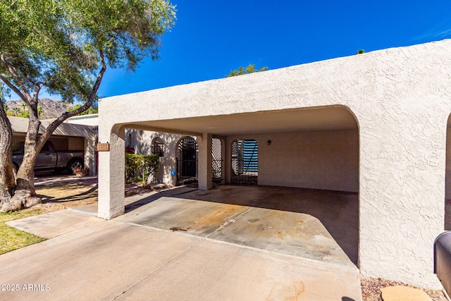 exterior space with a carport